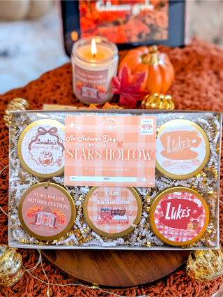 Gift set with 'Stars Hollow' Autumn/ Fall theme featuring scented sweet 5 - 3oz candles on a decorative surface. Gilmore themed 